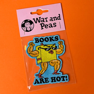 Iron-on patch featuring a playful, posing book with the fun slogan 'Books are hot!' – perfect for book lovers who want to show off their passion for reading in a quirky and stylish way!