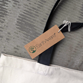 Earth Aware tag on a product with a gray background
