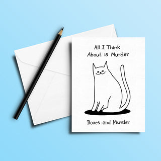 Hand-drawn greeting card featuring a black cat illustration and the humorous quote ‘All I Think About is Murder – Boxes and Murder’ on white cardstock, paired with a white envelope and black pencil. A perfect, unique gift for cat lovers and true crime fans—artistic, handmade, and full of dark humor.
