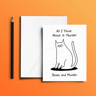 Creative handmade cat greeting card with the witty text ‘All I Think About is Murder – Boxes and Murder’ in black on a white background, displayed with a white envelope and black pencil. Ideal as a quirky, colorful gift for humor lovers and cat owners—authentic, artistic, and one-of-a-kind.