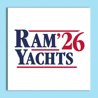 A square white card or sign featuring the text 'RAM'26 YACHTS' in navy blue and red lettering, centered on a light blue background.