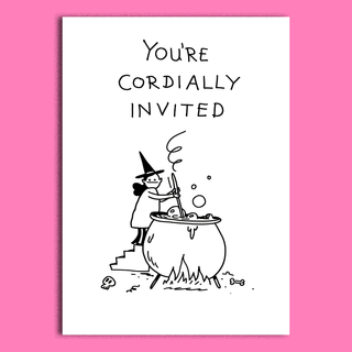 A white rectangular card or print with black hand-drawn text reading 'YOU'RE CORDIALLY INVITED' above a simple illustration of a witch stirring a cauldron. The card is centered on a solid pink background.